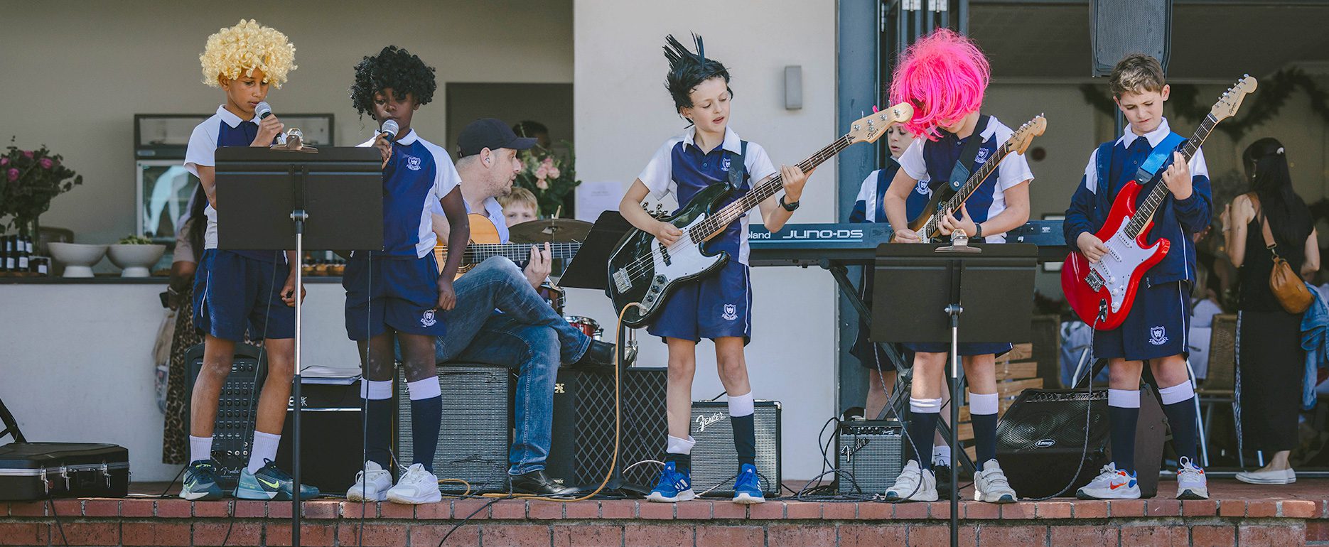 Guitar students performing during a music concert in Cape Town